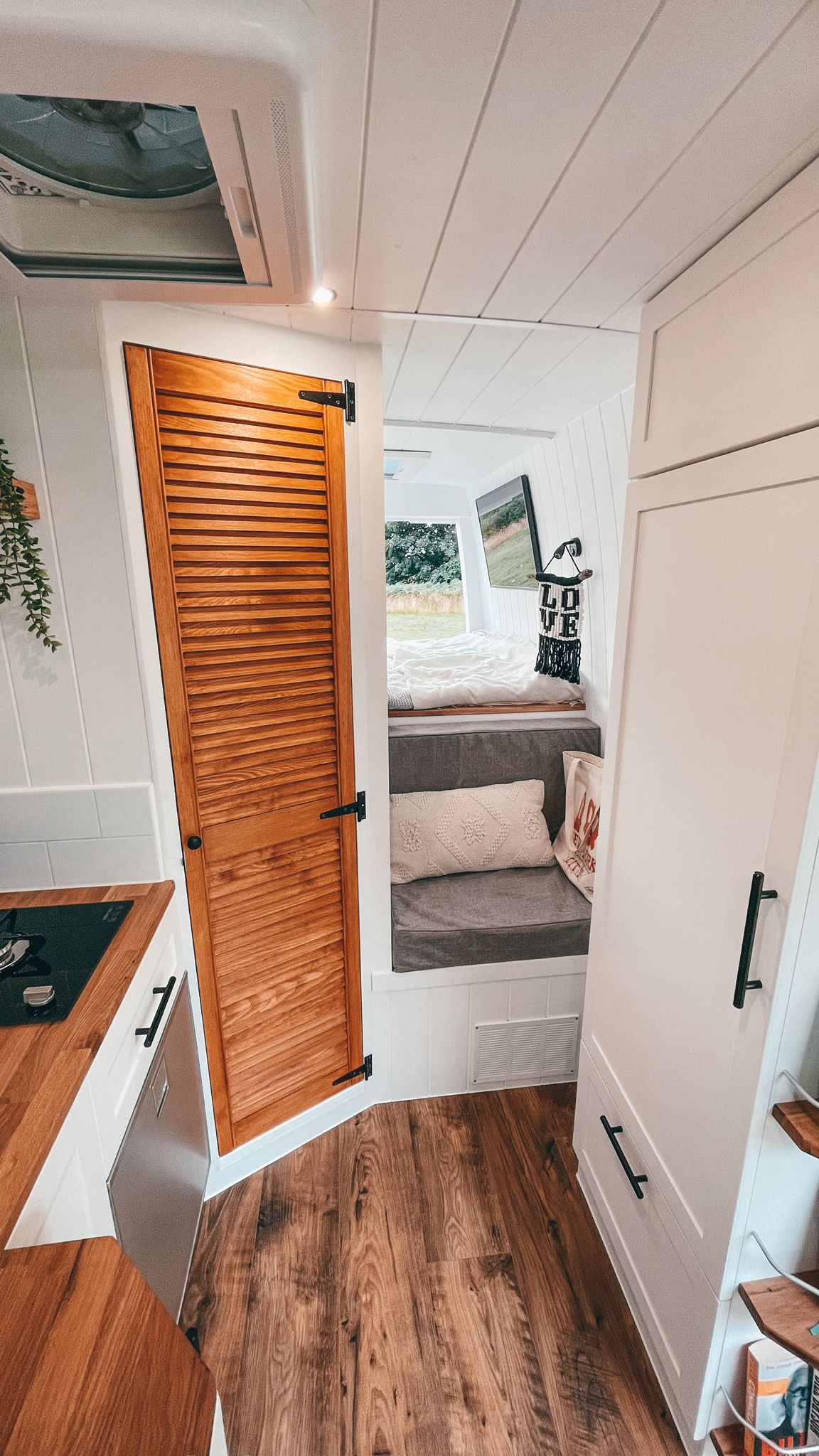 Inigo's beautiful interior — the cosy nook lounge leading to the double bed